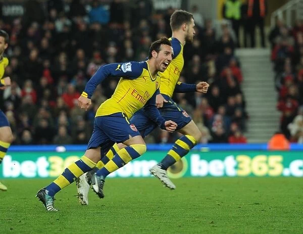 Santi Cazorla and Aaron Ramsey Celebrate Arsenal's Goal Against Stoke City (2014-15)