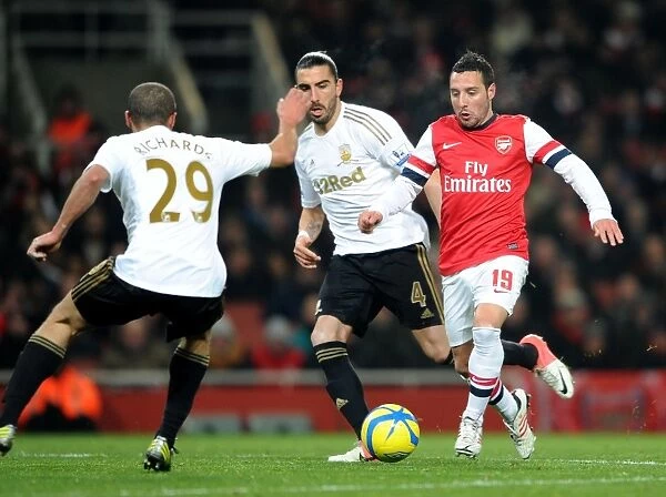 Santi Cazorla Charges Forward Against Ashley Richards and Chico Flores in Arsenal's FA Cup Third Round Replay vs Swansea City