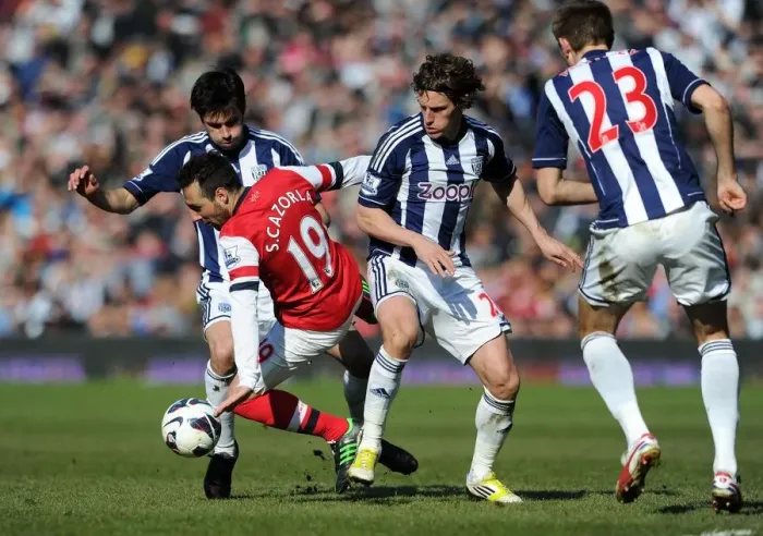 Framed Print : Santi Cazorla Fouled by Billy Jones and Claudio Yacob in West Bromwich Albion vs Arsenal, Premier League 2012-13