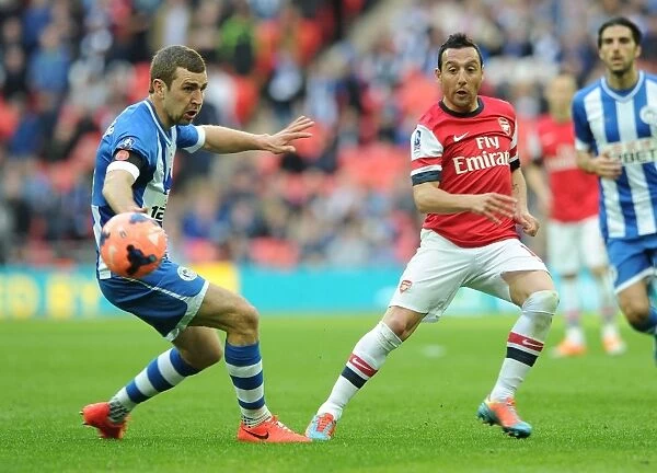 Santi Cazorla vs. James McArthur: Intense Battle in Arsenal's FA Cup Semi-Final Clash with Wigan Athletic