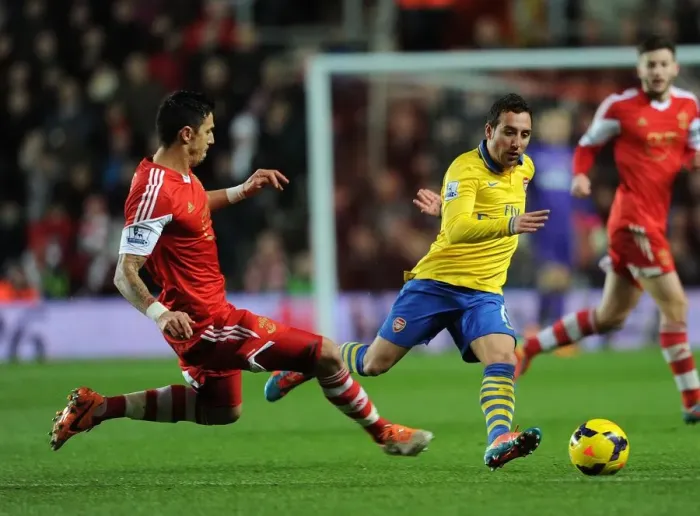 Framed Print : Santi Cazorla vs Jose Fonte: Intense Battle in Southampton vs Arsenal Premier League Clash