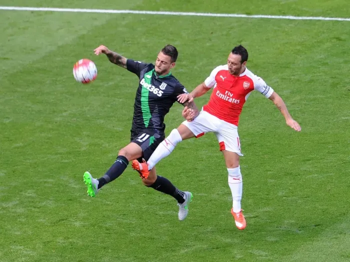 Framed Print : Santi Cazorla vs. Mato Joselu: Intense Battle in Arsenal's Victory over Stoke City Framed Print : Santi Cazorla vs. Mato Joselu: Intense Battle in Arsenal's Victory over Stoke City