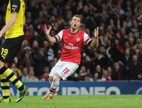 Santi Cazorla's Thundering Shot Hits the Crossbar: Arsenal vs Borussia Dortmund, UEFA Champions League