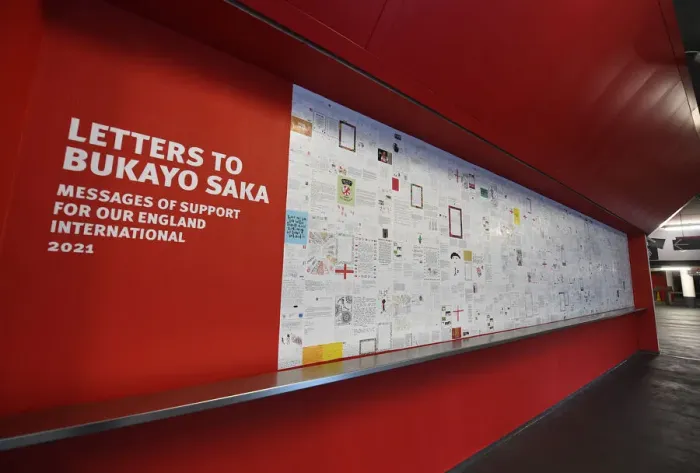 Framed Print : Sea of Support: Arsenal Fans Unite for Bukayo Saka at Emirates Stadium