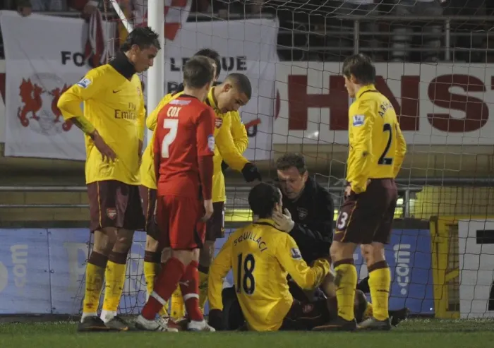Framed Print : Sebastien Squillaci is treated by Arsenal physio Colin Lewin. Leyton Orient 1: 1 Arsenal Framed Print : Sebastien Squillaci is treated by Arsenal physio Colin Lewin. Leyton Orient 1: 1 Arsenal