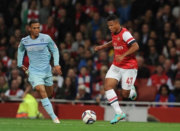 Serge Gnabry Breaks Past Coventry's Jordan Clarke in Arsenal's Capital One Cup Clash