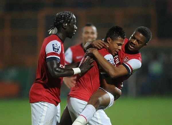 Serge Gnabry celebrates scoring Arsenals 1st goal with Chuba Akpom and Bacary Sagna