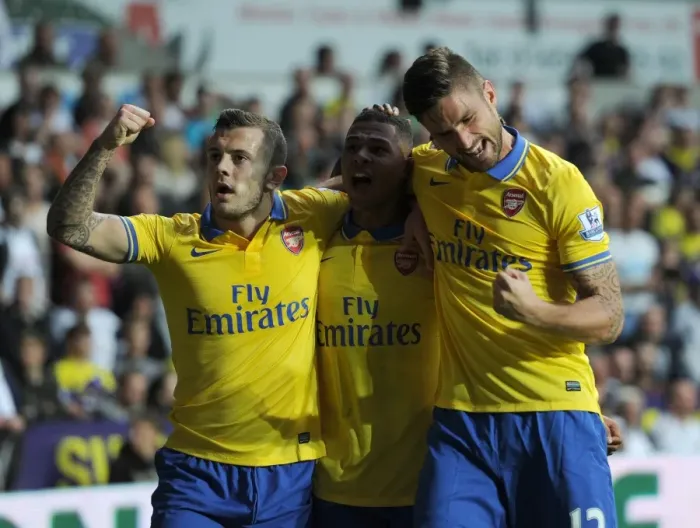 Framed Print : Serge Gnabry, Jack Wilshere, and Olivier Giroud Celebrate Arsenal's First Goal vs Swansea City (2013-14)
