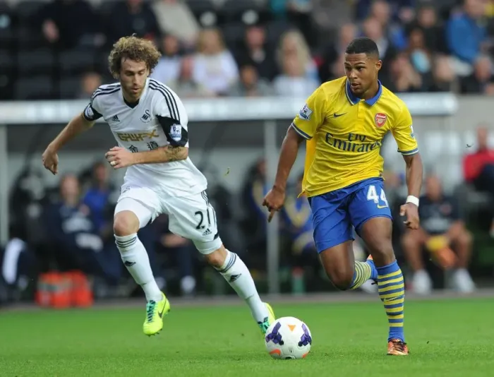 Framed Print : Serge Gnabry vs Jose Canas: Battle at Liberty Stadium - Swansea City vs Arsenal, Premier League 2013-14 Framed Print : Serge Gnabry vs Jose Canas: Battle at Liberty Stadium - Swansea City vs Arsenal, Premier League 2013-14