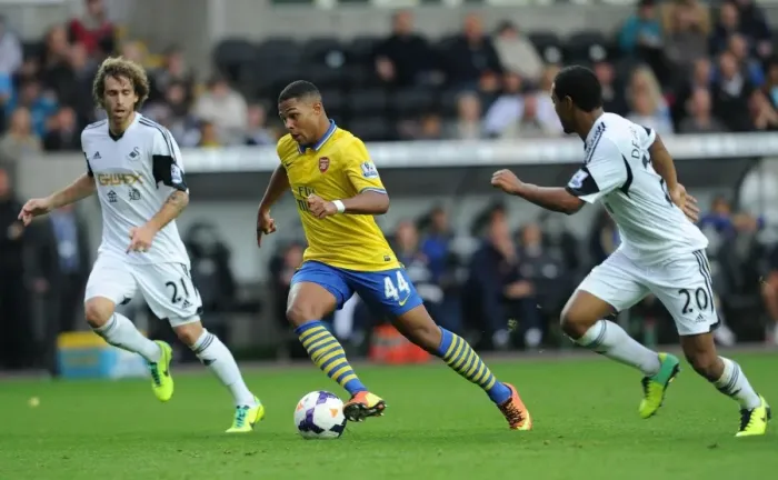 Framed Print : Serge Gnabry vs. Jose Canas and Jonathan De Guzman: Intense Battle at Swansea City vs. Arsenal (2013-14) Framed Print : Serge Gnabry vs. Jose Canas and Jonathan De Guzman: Intense Battle at Swansea City vs. Arsenal (2013-14)