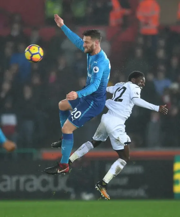 Framed Print : Shkodran Mustafi (Arsenal) Nathan Dyer (Swansea). Swansea 3: 1 Arsenal. Premier League