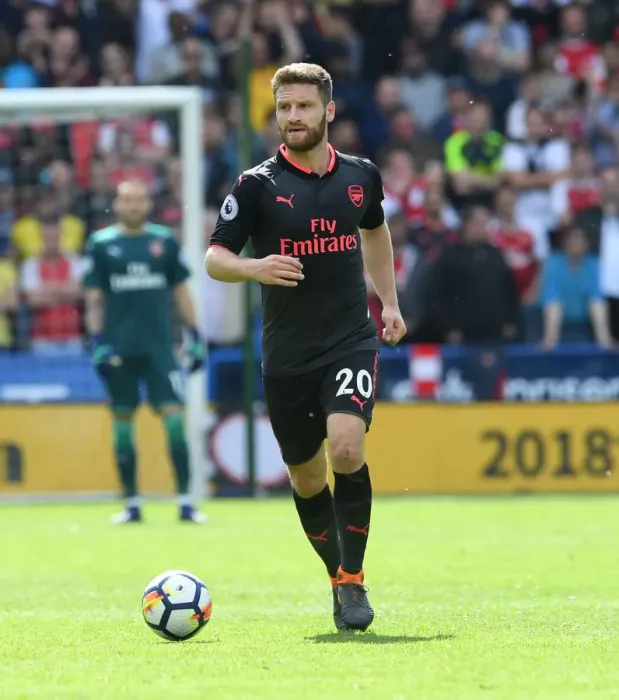 Framed Print : Shkodran Mustafi Focuses in Huddersfield Town vs Arsenal Premier League Clash Framed Print : Shkodran Mustafi Focuses in Huddersfield Town vs Arsenal Premier League Clash