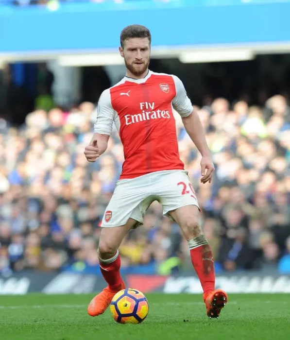 Framed Print : Shkodran Mustafi: Unyielding Determination in the Heat of the Chelsea vs Arsenal Rivalry, Premier League 2016-17