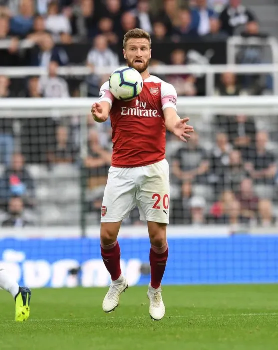 Framed Print : Shkodran Mustafi's Unwavering Concentration in the Heat of Newcastle United vs Arsenal FC Clash (2018-19)