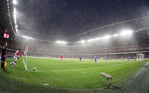 Snow falls during the match at Emirates. Arsenal 2: 2 Everton. Barclays Premier League