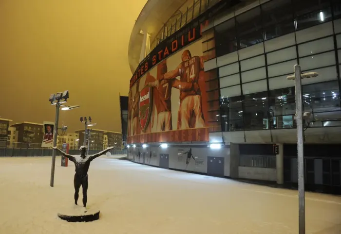 Framed Print : Snowy Emirates Stadium: Arsenal's Winter Showdown