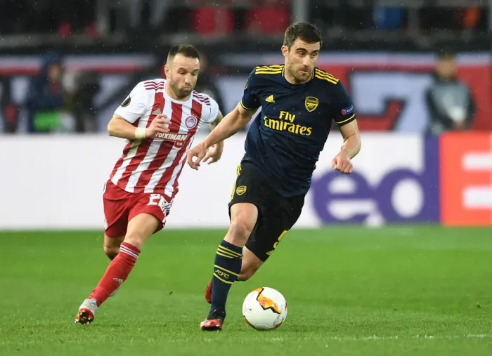 Framed Print : Sokratis Clashes with Valbuena: Olympiacos vs. Arsenal, UEFA Europa League 2019-20 Round of 32 - First Leg
