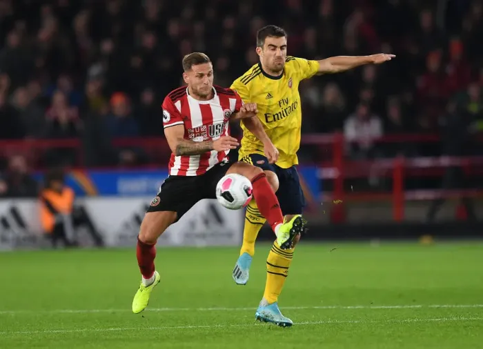Framed Print : Sokratis vs. Billy Sharp: Intense Battle at Bramall Lane - Sheffield United vs. Arsenal, Premier League 2019-20