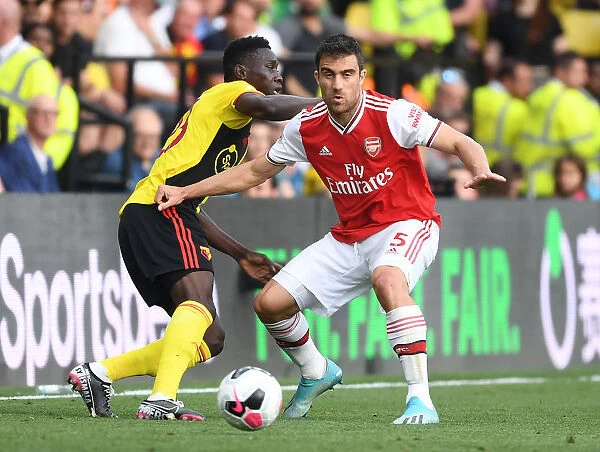 Sokratis vs Sarr: A Footballing Battle in the Watford vs Arsenal Premier League Clash (2019-20)