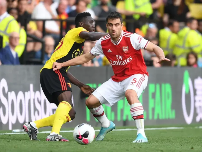 Framed Print : Sokratis vs Sarr: A Footballing Battle in the Watford vs Arsenal Premier League Clash (2019-20)