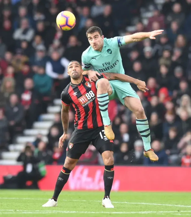 Framed Print : Sokratis vs. Wilson: Intense Battle in AFC Bournemouth vs. Arsenal FC Premier League Clash