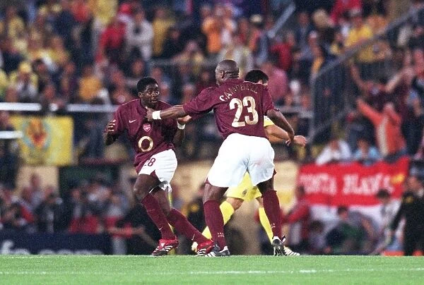 Sol Campbell and and Kolo Toure (Arsenal) celebrate at the final whistle