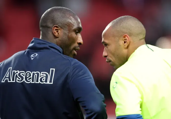 Framed Print : Sol Campbell (Arsenal) chats with Thierry Henry (Barcelona and Ex Arsenal) before the match