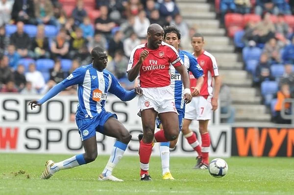 Sol Campbell (Arsenal) Mohamed Diame (Wigan). Wigan Athletic 3: 2 Arsenal
