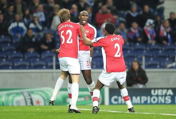 Sol Campbell celebrates scoring the Arsenal goal with Nicklas Bendtner and Abou Diaby