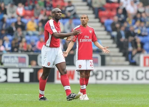 Sol Campbell and Gael Clichy (Arsenal). Wigan Athletic 3: 2 Arsenal, FA Barclays Premier League