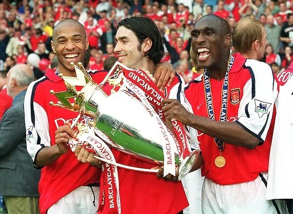 Sol Campbell, Robert Pires and Thierry Henry with the F.A