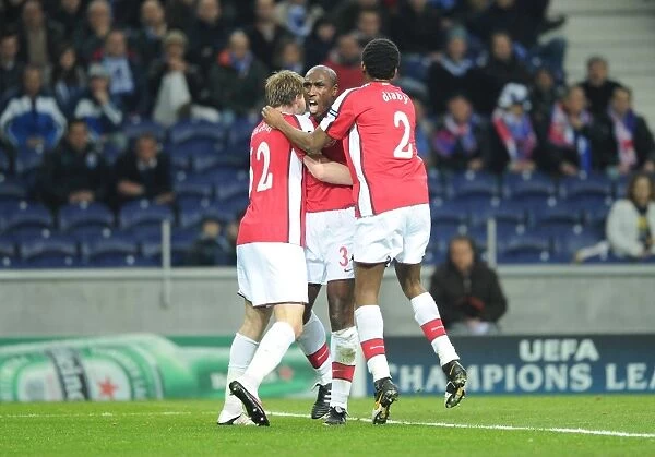 Sol Campbell's Goal Celebration with Bendtner and Diaby: Arsenal's Victory Moment against FC Porto in the UEFA Champions League