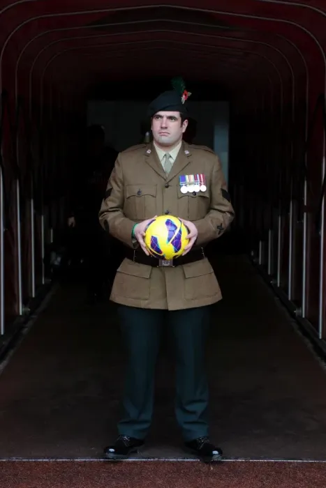 Framed Print : A Soldier bring on the matchball. Arsenal 3: 3 Fulham. Barclays Premier League. Emirates Stadium