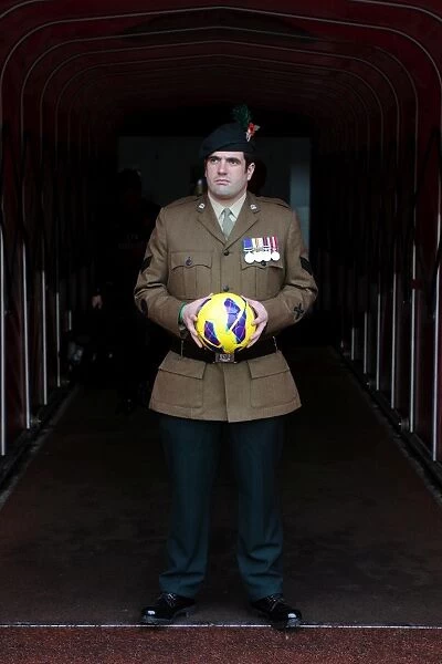 A Soldier bring on the matchball. Arsenal 3:3 Fulham. Barclays Premier League. Emirates Stadium
