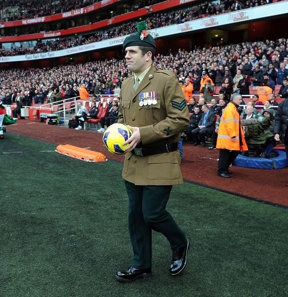 A Soldier brings on the matchball. Arsenal 3:3 Fulham. Barclays Premier League. Emirates Stadium