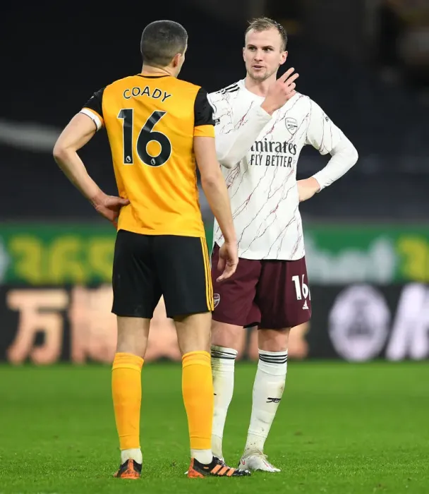 Framed Print : Sportsmanship in Rivalry: Holding and Coady's Heartfelt Moment after Wolverhampton vs Arsenal