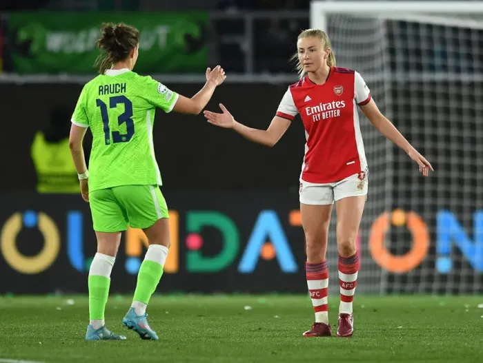 Framed Print : Sportsmanship Triumph: Leah Williamson and Felicitas Rauch's Heartwarming Handshake after Arsenal's Champions League Victory