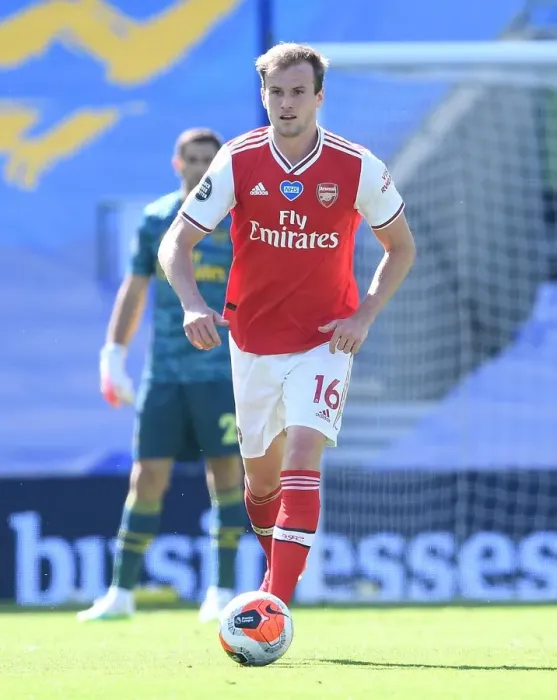 Framed Print : Empty Stands: Arsenal's Rob Holding in Action against Brighton & Hove Albion (2019-2020) Framed Print : Empty Stands: Arsenal's Rob Holding in Action against Brighton & Hove Albion (2019-2020)