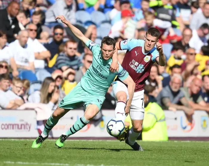 Framed Print : Stephan Lichtsteiner vs Johann Berg Gudmundsson: Intense Clash Between Burnley and Arsenal in Premier League