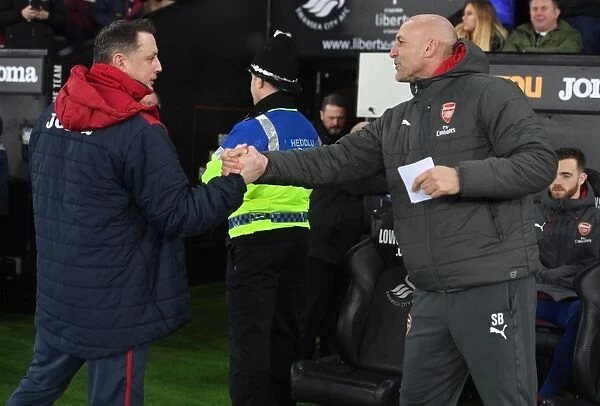 Steve Bould and Tony Roberts Exchange Handshakes Before Swansea City vs Arsenal (2017-18)
