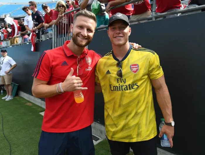 Framed Print : Surprise Encounter: Christian McCaffrey Meets Arsenal's Shkodran Mustafi at 2019 International Champions Cup in Charlotte Framed Print : Surprise Encounter: Christian McCaffrey Meets Arsenal's Shkodran Mustafi at 2019 International Champions Cup in Charlotte