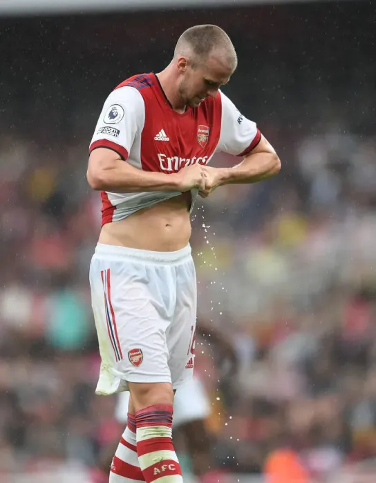 Framed Print : Sweat and Determination: Arsenal's Rob Holding Rings Out Shirt Amidst Intense Arsenal v Chelsea Rivalry (Premier League 2021-22) Framed Print : Sweat and Determination: Arsenal's Rob Holding Rings Out Shirt Amidst Intense Arsenal v Chelsea Rivalry (Premier League 2021-22)
