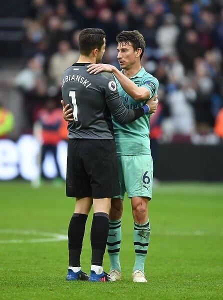 Former Teammates Reunited: Koscielny Embraces Fabianski After West Ham vs. Arsenal Clash
