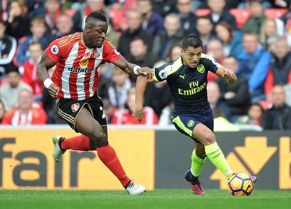 Tense Encounter: Alexis Sanchez vs Lamine Kone in Sunderland vs Arsenal Football Rivalry