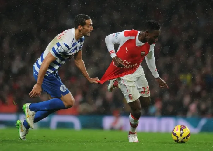 Framed Print : Tense Rivalry: Welbeck vs. Ferdinand Clash at Arsenal vs. QPR
