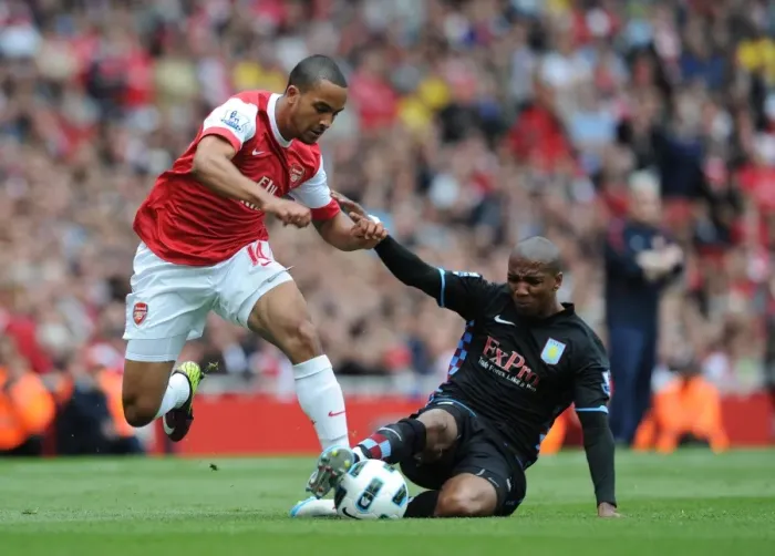 Framed Print : Theo Walcott (Arsenal) Ashley Young (Aston Villa). Arsenal 1: 2 Aston Villa