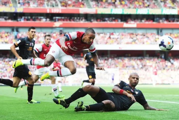 Framed Print : Theo Walcott (Arsenal) Felipe Melo (Galatasaray). Arsenal 1: 2 Galatasaray. Emirates Cup Day Two