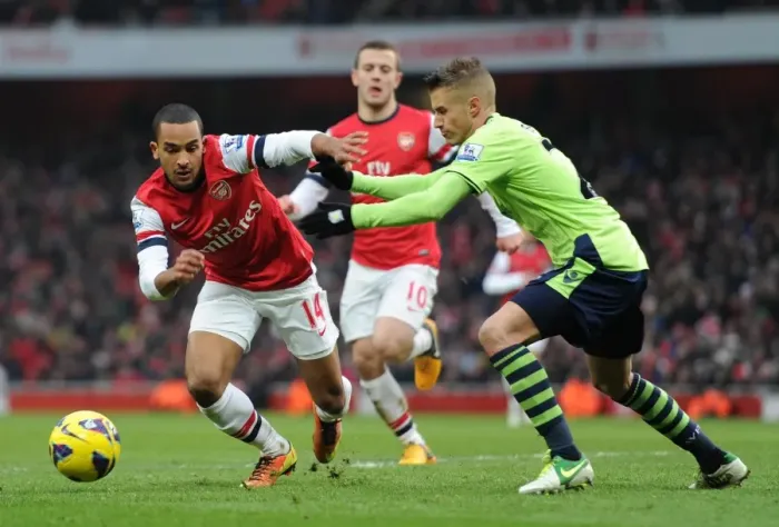 Framed Print : Theo Walcott (Arsenal) Joe Bennett (Villa). Arsenal 2: 1 Aston Villa. Barclays Premier League Framed Print : Theo Walcott (Arsenal) Joe Bennett (Villa). Arsenal 2: 1 Aston Villa. Barclays Premier League