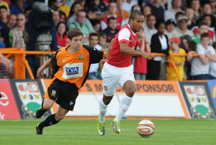 Framed Print : Theo Walcott (Arsenal) John McGicks (Barnet). Barnet 0: 4 Arsenal, Pre season friendly Framed Print : Theo Walcott (Arsenal) John McGicks (Barnet). Barnet 0: 4 Arsenal, Pre season friendly
