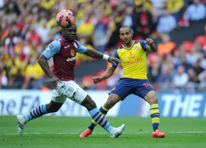Framed Print : Theo Walcott (Arsenal). Jores Okore (Villa). Arsenal 4: 0 Aston Villa. FA Cup Final